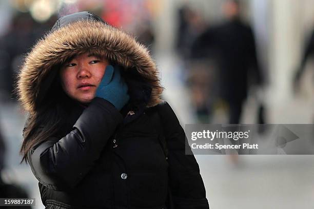 Woman walks down the street on one of the coldest days of the year on January 22, 2013 in New York City. New York, and much of the Northeast, will be...