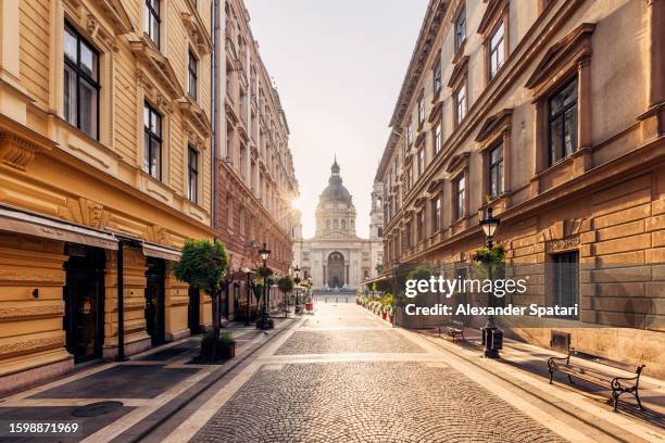 pedestrian street in budapest old town leading to st stephen's basilica, hungary - budapest street stock pictures, royalty-free photos & images