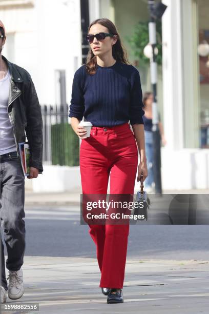 Alexa Chung and Tom Sturridge walking through Notting Hill on August 07, 2023 in London, England.