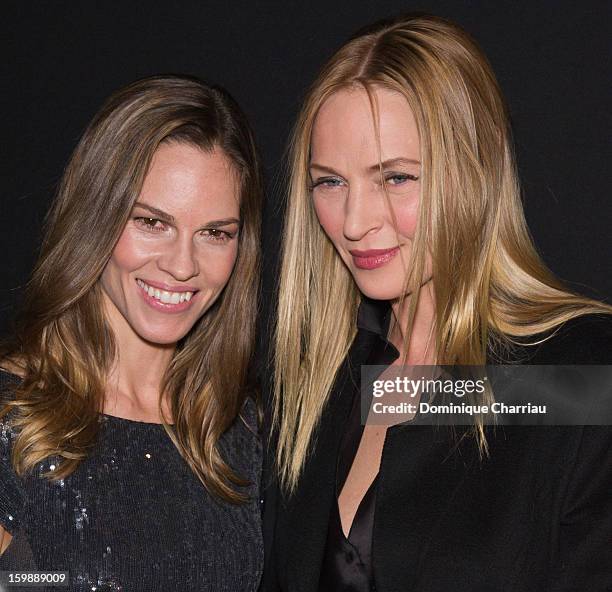 Hilary Swank and Uma Thurman attend the Giorgio Armani Prive Spring/Summer 2013 Haute-Couture show as part of Paris Fashion Week at Theatre National...