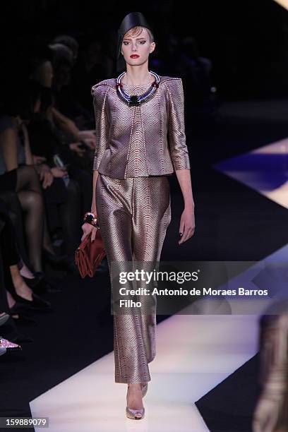 Model walks the runway during the Giorgio Armani Prive Spring/Summer 2013 Haute-Couture show as part of Paris Fashion Week at Theatre National de...