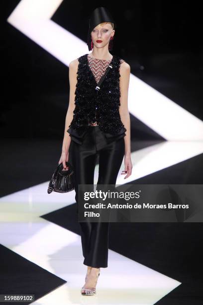 Model walks the runway during the Giorgio Armani Prive Spring/Summer 2013 Haute-Couture show as part of Paris Fashion Week at Theatre National de...