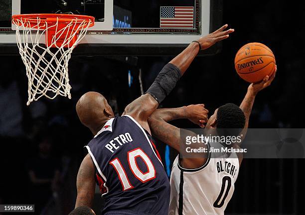 Andray Blatche of the Brooklyn Nets in action against Johan Petro of the Atlanta Hawks at Barclays Center on January 18, 2013 in the Brooklyn borough...