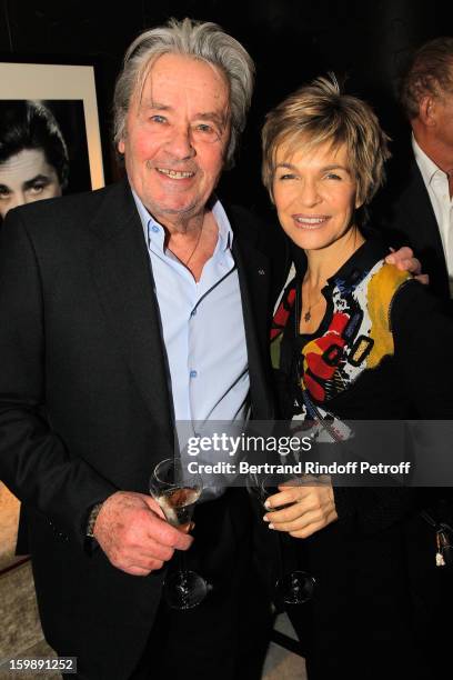 Alain Delon and Veronique Jannot attend 'La Petite Maison De Nicole' Inauguration Cocktail at Hotel Fouquet's Barriere on January 22, 2013 in Paris,...