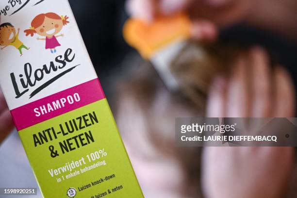 Illustration picture shows a child receiving care against head lice, in Brussels, Monday 14 August 2023. Head lice are small insects that live in...