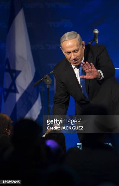 Israeli Prime Minister Benjamin Netanyahu and ultra-nationalist Avigdor Lieberman of the Likud-Beitenu coalition party greet supporters as they...