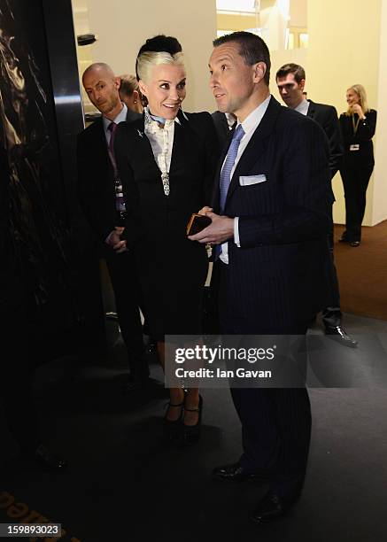 Jean-Marc Pontroue, CEO of Roger Dubuis talks to Daphne Guinness, friend of the brand as she visits the Roger Dubuis booth during the 23rd Salon...