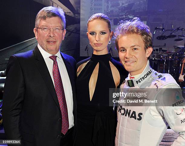 Ross Brawn, Karolina Kurkova and Nico Rosberg attend the IWC Schaffhausen Race Night event during the Salon International de la Haute Horlogerie 2013...