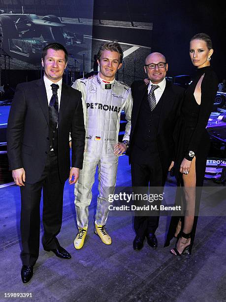 Alexei Nemov, Nico Rosberg, IWC Schaffhausen CEO Georges Kern and Karolina Kurkova attend the IWC Schaffhausen Race Night event during the Salon...