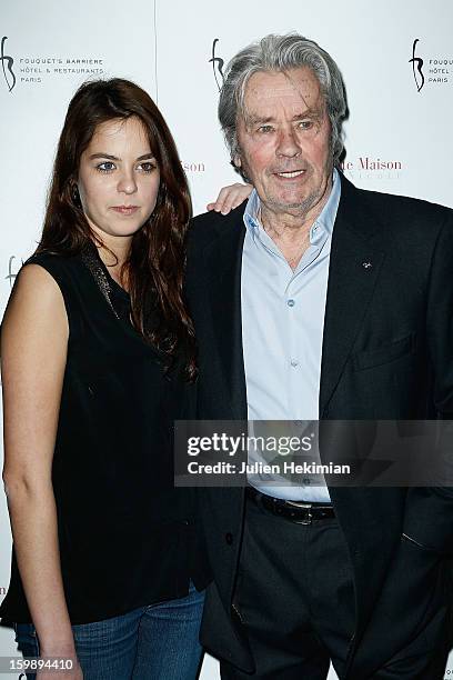 Alain Delon and his daughter Anouchka attend 'La Petite Maison De Nicole' Inauguration Photocall at Hotel Fouquet's Barriere on January 22, 2013 in...