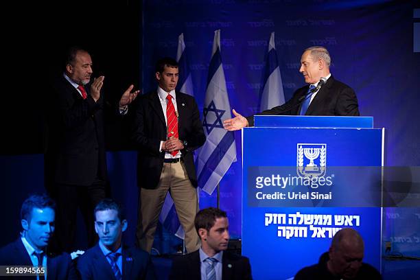 Israeli Prime Minister Benjamin Netanyahu shakes hands with Former Israel Minister for Foreign Affairs Avigdor Liberman at his election campaign...