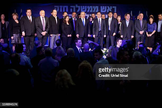 Israeli Prime Minister Benjamin Netanyahu and his party members stand on stage at his election campaign headquarters on Janurary 23, 2013 in Tel...
