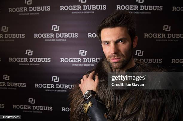 Model poses at the Roger Dubuis booth during the 23rd Salon International de la Haute Horlogerie at the Geneva Palexpo on January 22, 2013 in Geneva,...