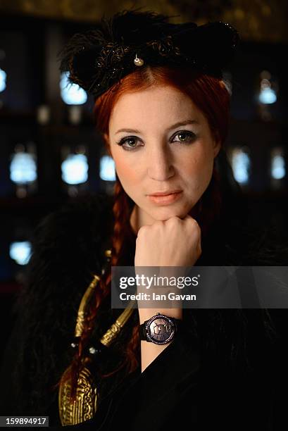 Model poses at the Roger Dubuis booth during the 23rd Salon International de la Haute Horlogerie at the Geneva Palexpo on January 22, 2013 in Geneva,...