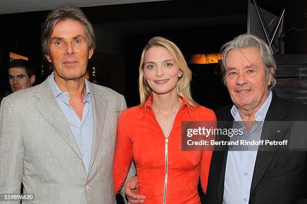 Dominique Desseigne, Sarah Marshall and Alain Delon attend 'La Petite Maison De Nicole' Inauguration Cocktail at Hotel Fouquet's Barriere on January...