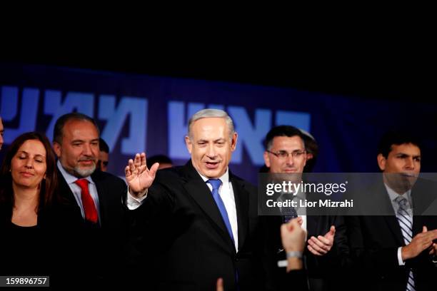 Israeli Prime Minister Benjamin Netanyahu waves to supporters at his election campaign headquarters on Janurary 23, 2013 in Tel Aviv, Israel....