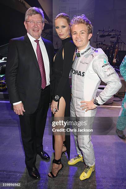 Ross Brawn, Karolina Kurkova and Nico Rosberg visit the IWC booth during the Salon International de la Haute Horlogerie 2013 at Palexpo on January...