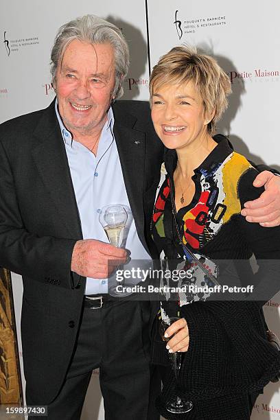 Alain Delon and Veronique Jannot attend 'La Petite Maison De Nicole' Inauguration Photocall at Hotel Fouquet's Barriere on January 22, 2013 in Paris,...