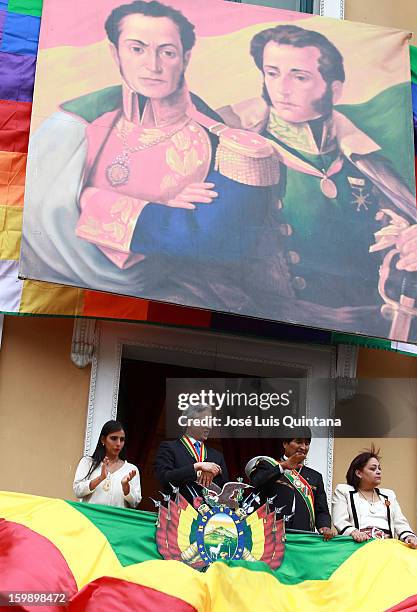 President Evo Morales and Vice President Álvaro García Linera salute from the balcony of the government palace Official to Social Organizations under...