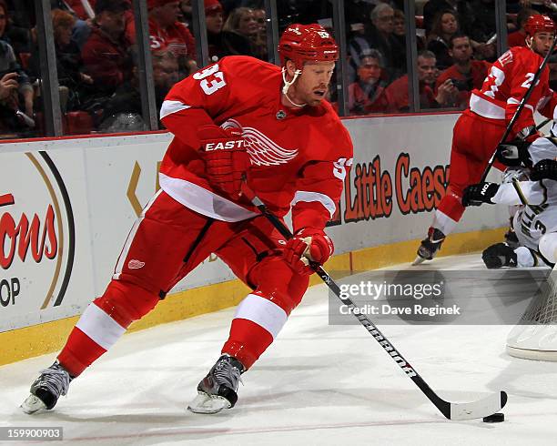 Johan Franzen of the Detroit Red Wings skates with the puck during a NHL game against the Dallas Stars at Joe Louis Arena on January 22, 2013 in...