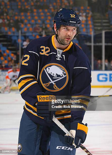 John Scott of the Buffalo Sabres stands on th ice during pregame warm-ups prior to playing the Philadelphia Flyers at First Niagara Center on January...