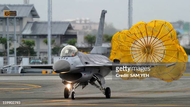 Made F-16 fighter lands on the run way at the eastern Hualien air force base on January 23, 2013. The Taiwan air force demonstrated their combat...