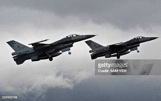 Two US-made F-16 fighters in the air during an scramble take off at the eastern Hualien air force base on January 23, 2013. The Taiwan air force...
