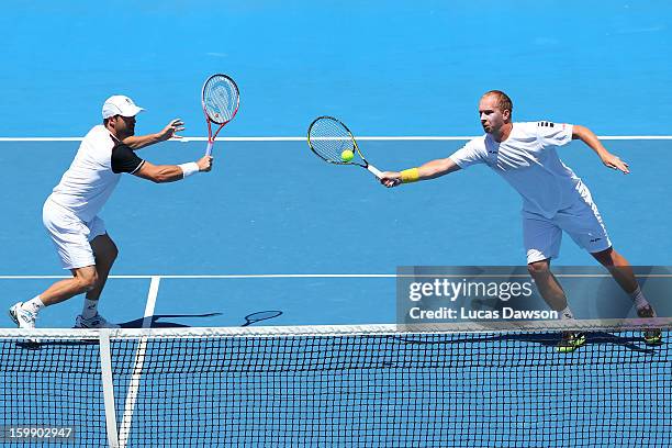 Lukas Dloughy of the Czech Republic plays a forehand in his fourth round doubles match with Daniele Bracciali of Italy against Mike Bryan of the...