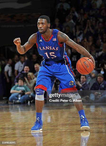 Guard Elijah Johnson of the Kansas Jayhawks brings the ball up court against the Kansas State Wildcats during the first half on January 22, 2013 at...