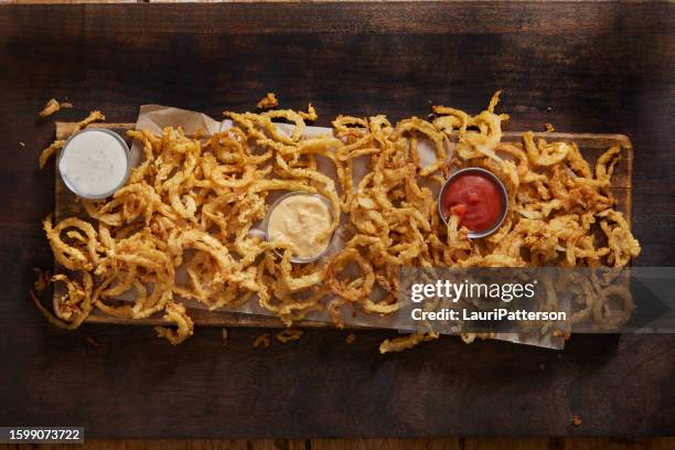 crispy buttermilk onion strings - string of onions stock pictures, royalty-free photos & images
