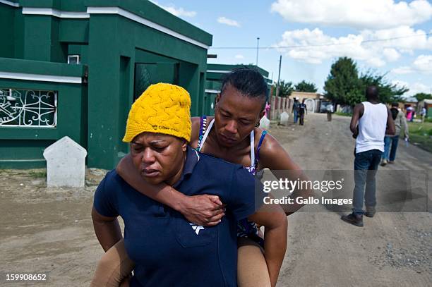 Woman is hit by a rubber bullet on January 22 in Sasolburg, South Africa. Government's announcement of its intention to merge municipal systems in...