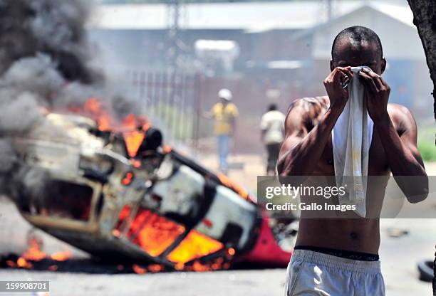 Shacks burn down on January 22 in Sasolburg, South Africa. Government's announcement of its intention to merge municipal systems in the Free State...