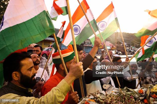 Kashmiri men wave Indian National Flag during Tiranga rally In Baramulla Jammu and Kashmir India on 14 August 2023.