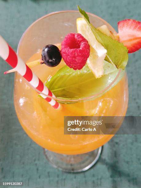 basil orange cocktail for aperitif drink alcohol - tequila sunrise stockfoto's en -beelden