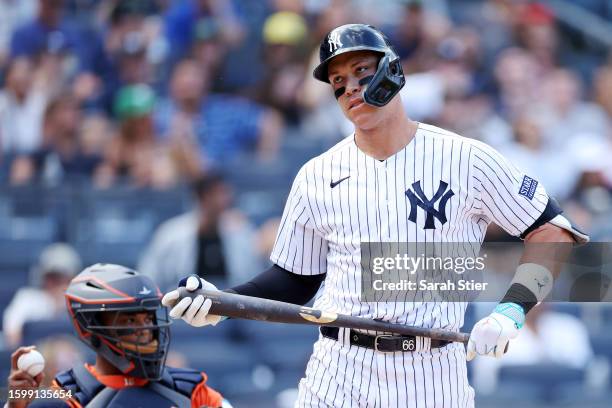 Aaron Judge of the New York Yankees reacts after striking out during the ninth inning against the Houston Astros at Yankee Stadium on August 06, 2023...