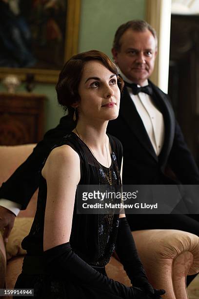 On set of Downton Abbey during production of series III with actors Michelle Dockery and Hugh Bonneville photographed for the Los Angeles Times on...