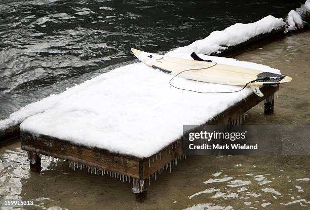 General view of a surf board at the Eisbach in the English Garden on January 19, 2013 in Munich, Germany. The man-made wave at the Eisbach , which...