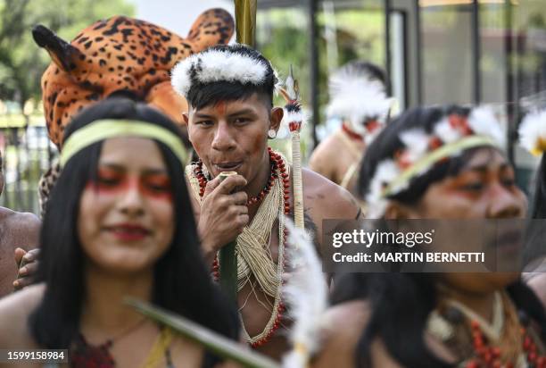 Members of the Waorani indigenous community demonstrate for peace, for nature and to promote a Yes vote in an upcoming referendum to end oil drilling...