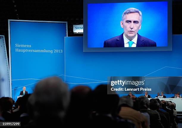 Peter Loescher, President and Chief Executive Officer of Siemens AG, speaks to the shareholders during the Siemens annual general shareholder's...