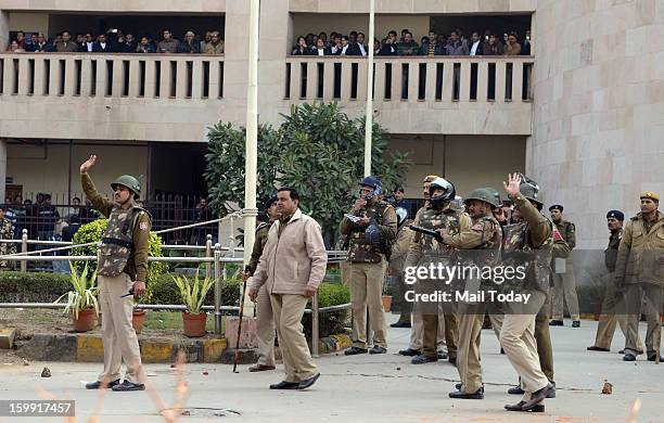 Police using teargas shells to disperse INLD supporters during a protest at Rohini district court in New Delhi on Tuesday. The court awarded 10 years...