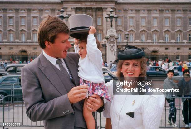 British golfer Nick Faldo with his wife Gill and daughter Natalie after receiving his MBE at Buckingham Palace, London, circa 1988.