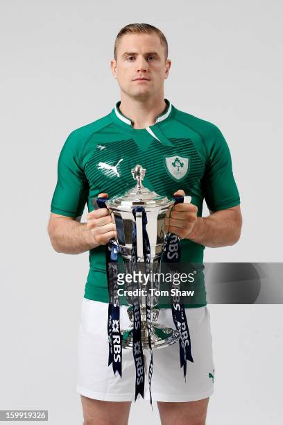 Ireland captain Jamie Heaslip poses with the Six Nations trophy during the RBS Six Nations launch at The Hurlingham Club on January 23, 2013 in...