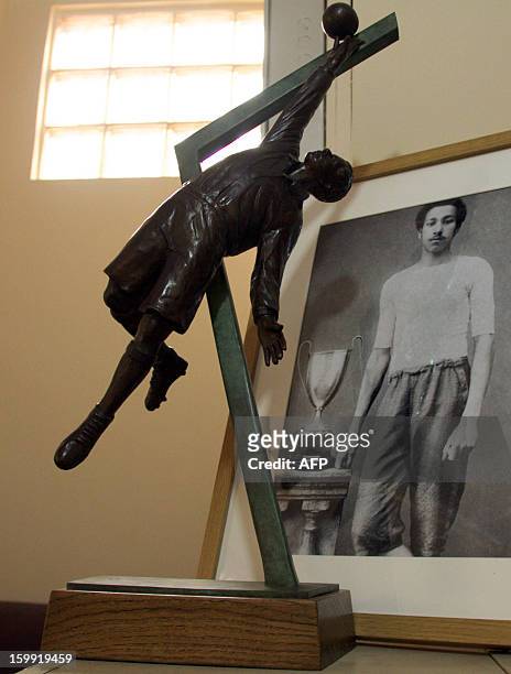 Statue and portrait of late footballer Arthur Wharton are pictured at the Ghana Football Association on January 15, 2013 in Accra, Ghana. On the...