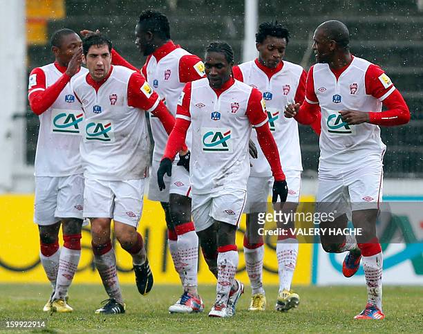 Nancy's Cameroonian forward Paul Alo'o Efoulou celebrates with team mates after scoring a goal during a French Cup round of 32 football match between...