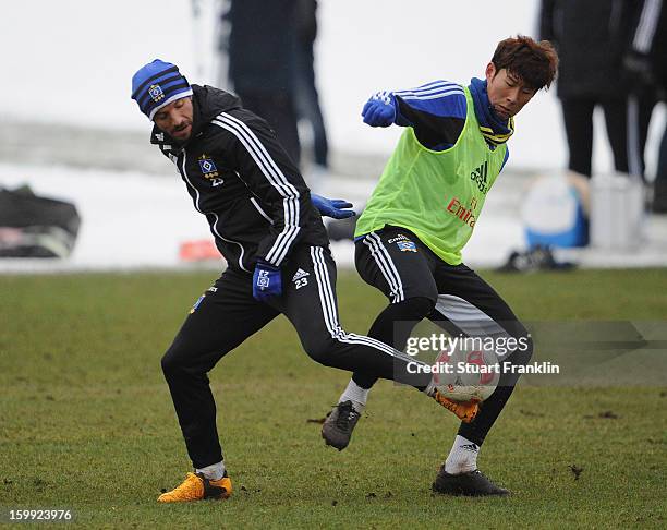 Heung Min Son and Rafael van der Vaart in action during a training session of Hamburg SV on January 23, 2013 in Hamburg, Germany.