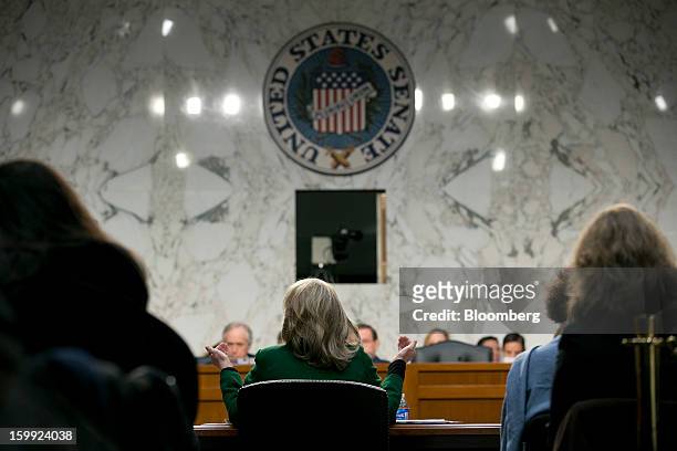 Secretary of State Hillary Clinton, center, speaks during a Senate Foreign Relations Committee hearing in Washington, D.C., U.S., on Wednesday, Jan....