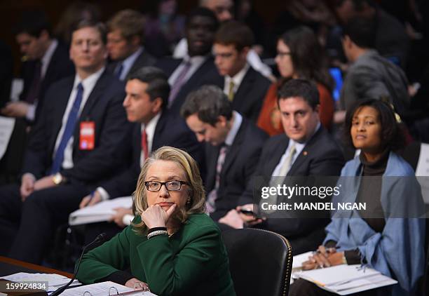 Secretary of State Hillary Clinton listens to a statment as she testifies before the Senate Foreign Relations Committee on the September 11, 2012...