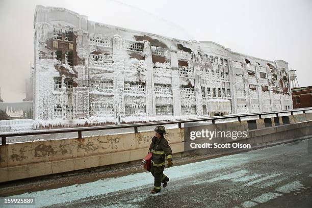 Firefighters work to extinguish a massive blaze at a vacant warehouse on January 23, 2013 in Chicago, Illinois. More than 200 firefighters battled a...