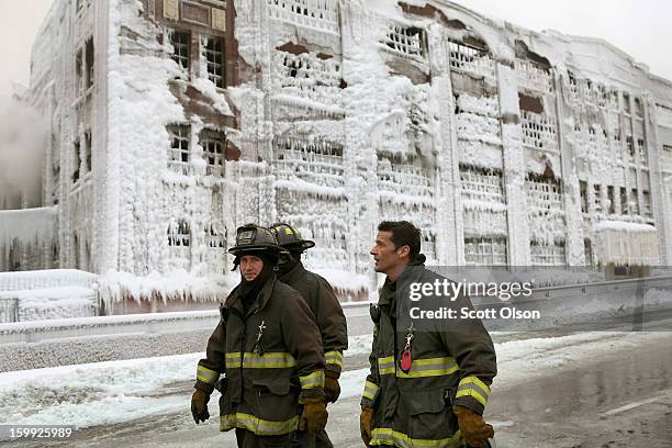 Firefighters work to extinguish a massive blaze at a vacant warehouse on January 23, 2013 in Chicago, Illinois. More than 200 firefighters battled a...