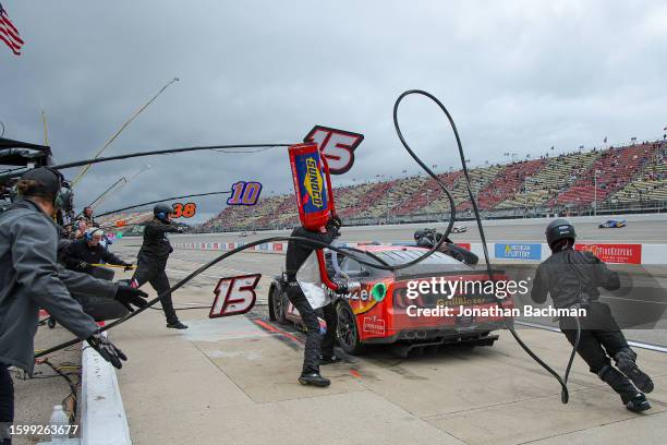 Yeley, driver of the Grill Blazers Ford, pits during the NASCAR Cup Series FireKeepers Casino 400 at Michigan International Speedway on August 07,...